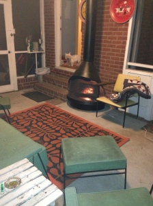 In place on the porch with the electric fireplace and apt to photobomb doggie Otis